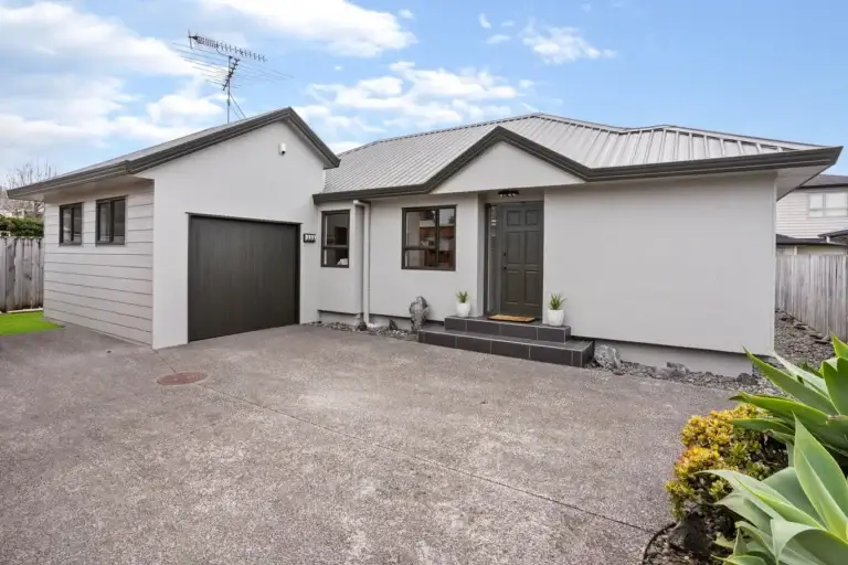 A successful resurfacing of a home, with a fresh coat of paint on the exterior of the home.