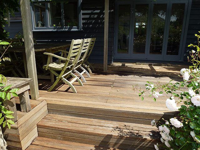 Patio deck wood staining and cleaning services.