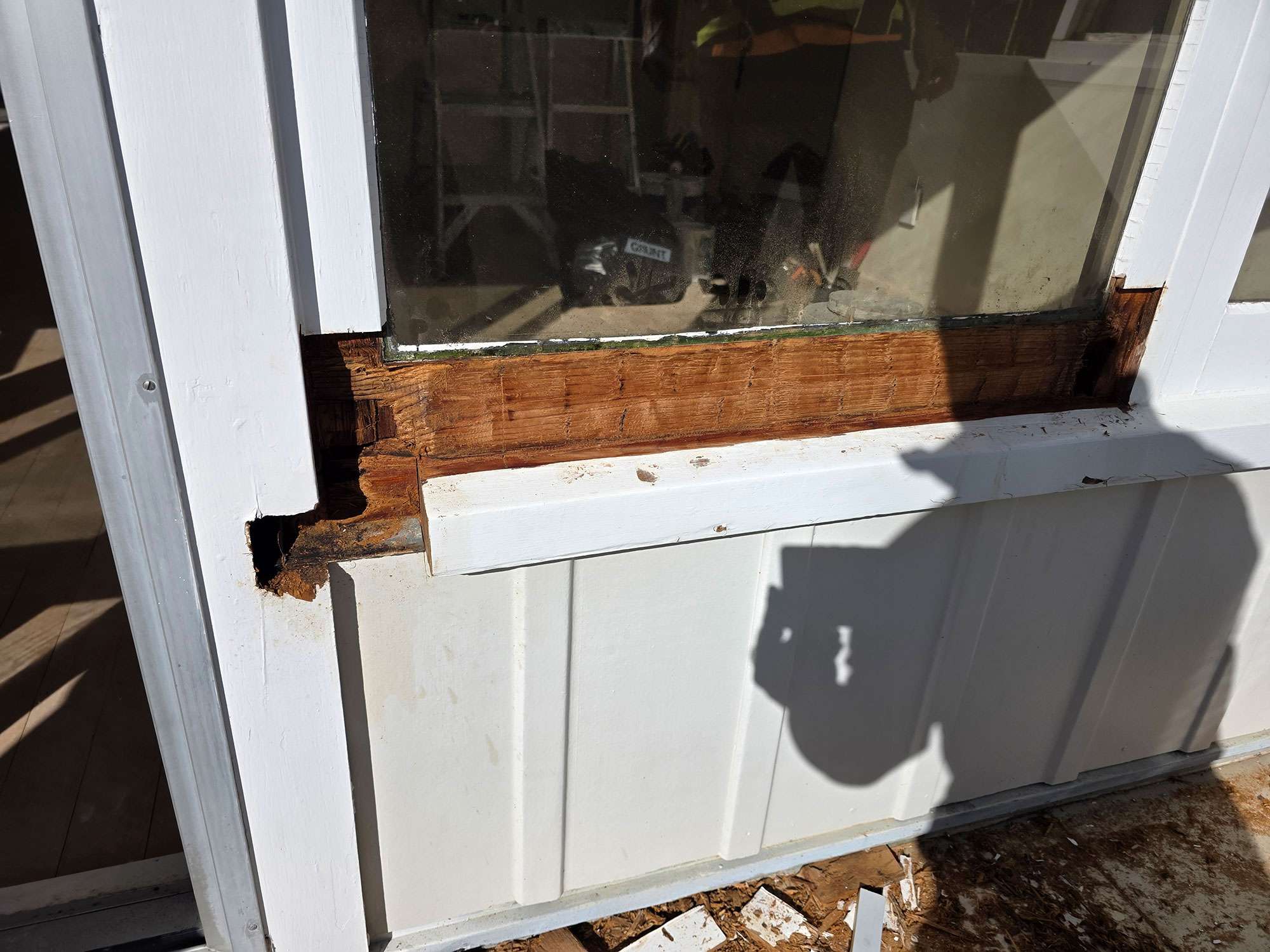 Window rot case study: Damaged window frame with wood rot and decay. Focus on window repair and home maintenance.