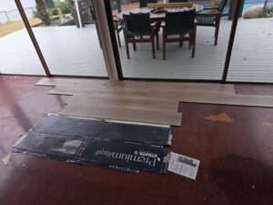 Installing Lemonade wood-look flooring. New plank flooring over old. Premiumish Strata 24 flooring installation in progress.