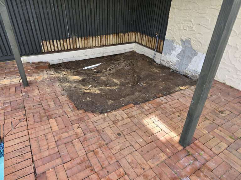 Spa removal and re-bricking project showing brick patio repair after removing a spa. Landscape construction, patio design.