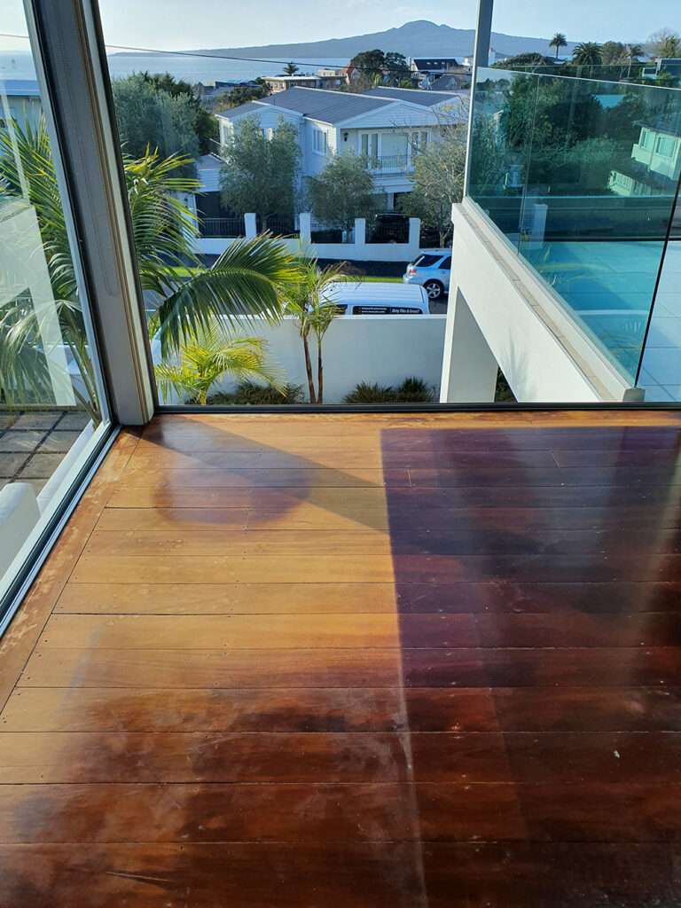 Timber Floor Refresh Case Study: Before and after of a revitalized hardwood floor with a view.