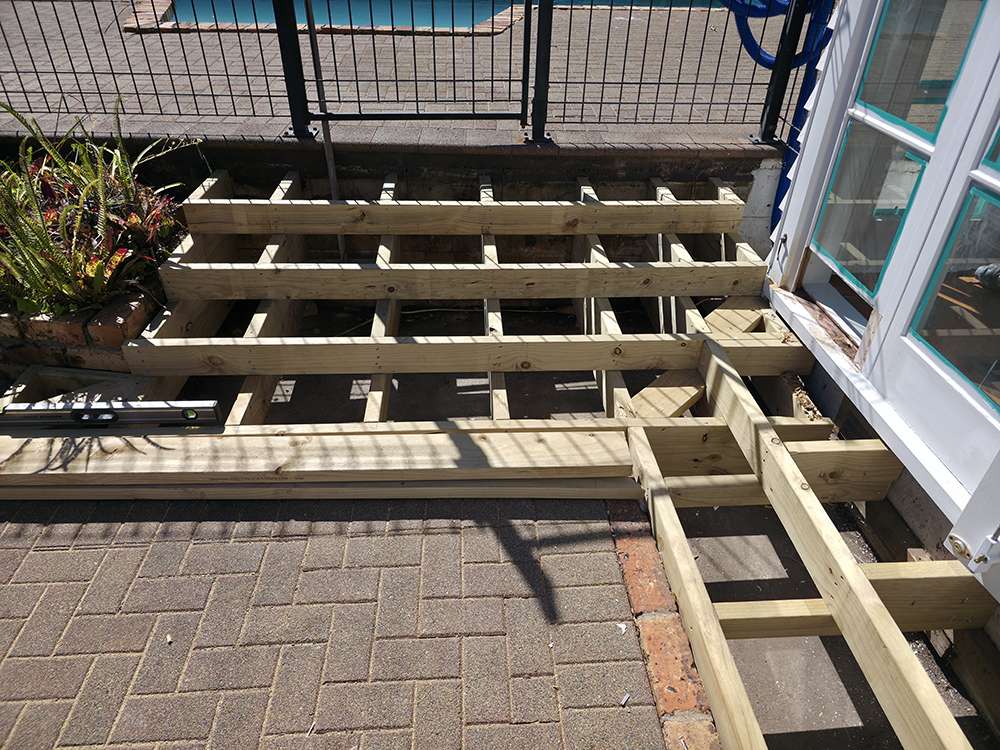 Decking Handrail Case Study: New timber frame for decking steps and handrail construction detail, replacing rotten timber.